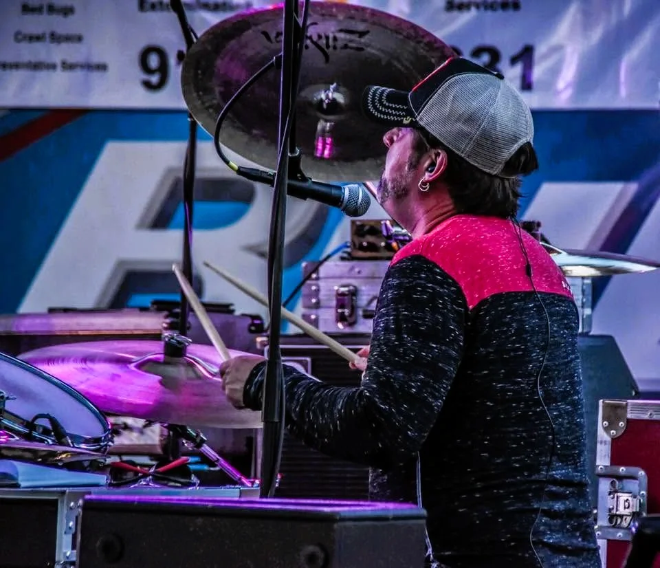 CA Anderson behind the kit live.